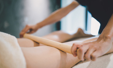 Thai massage therapist treating patient