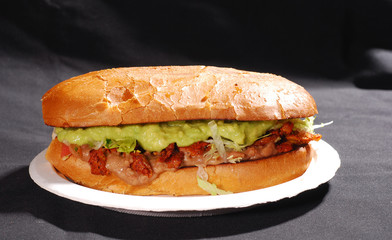 marinated pork guacamole beans mexican torta