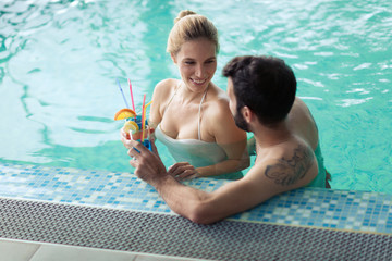 Happy couple relaxing at wellness spa center