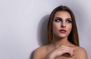 Naklejka premium Fashionable portrait of a girl model. Fashion, smoky eyes makeup.