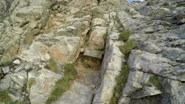 Mountain climber pov from helmet camera climbing to 