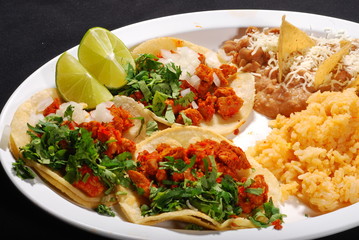 Three sof tacos plate, cilantro, rice and beans, cheese, lemon and chip. Adobada 3 tacos  plate, arroz y frijol