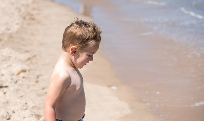 Little boy playing on the beach