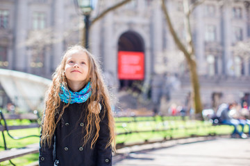 Adorable little girl walking at New York City outdoor