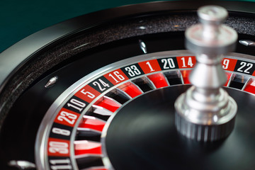 Casino roulette wheel and it's numbers in red and black color