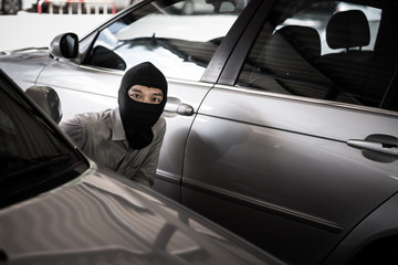 robber in black mask ,robbery concept.