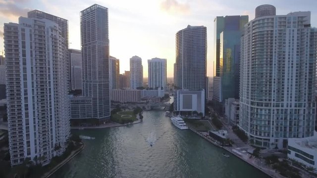 Beautiful Aerial view through waterway and buildings in Miami during sunset