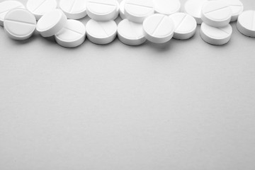 Health care concept. Pills on grey background