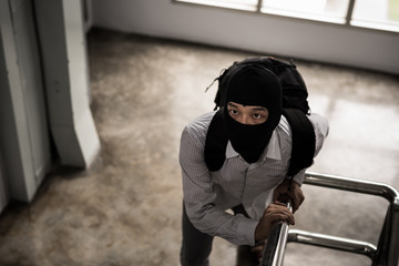 robber in black mask ,robbery concept.