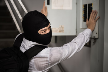 robber in black mask ,robbery concept.