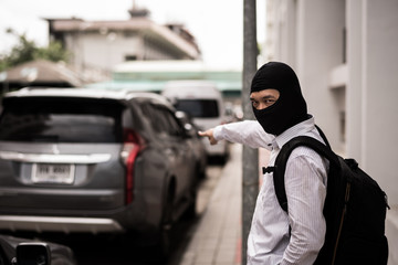 robber in black mask ,robbery concept.