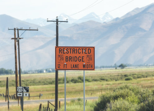 Restricted Bridge Sign near Mountains