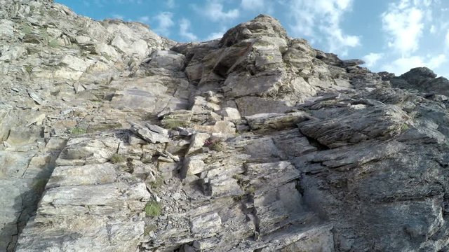 Mountain climber pov from helmet camera climbing to 