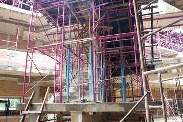 steel or iron under construction building site, For buoyancy of the building under construction, Round steel pipes of various sizes and color are used for weight,