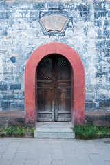 Chinese old traditional door and brick wall, Luodai, China