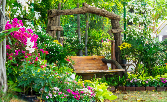 Wood chair in cozy flower garden./ Wood chair in cozy flower garden on summer.
