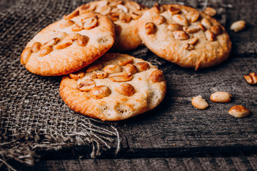 Close up Oatmeal Cookies with peanuts on dark wooden background table. Top view, close up, copy space