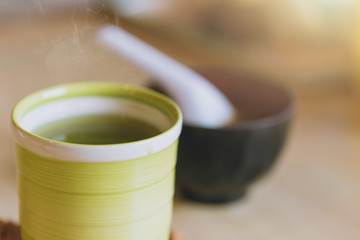 Matcha Japanese healthy drink. Hot Green tea drinking after food meal for good health.