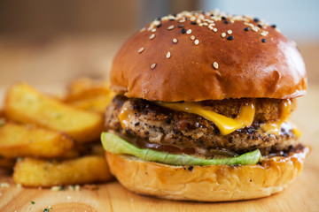 chicken burger on wooden board
