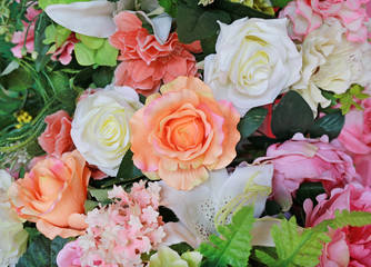 Artificial bouquet flowers background.