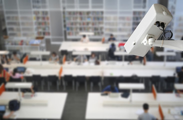 CCTV Camera Record on blurred background of people in the library, Security and safety concept.