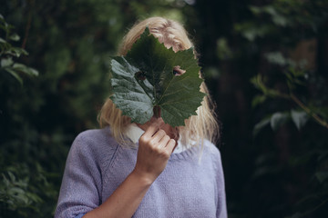 Woman with a Fresh Leaf over Face