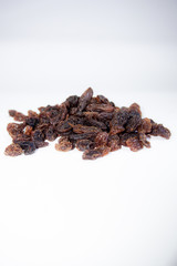 Dried raisins on a white background