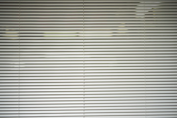 White horizontal metal roller blinds