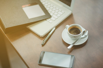 Closeup shot of laptop with digitaltablet and smartphone on desk. Modern devices on desk at office. Three different type of screen to put your responsive web page on.