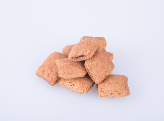 cookie or biscuits filled with chocolate cream on a background.