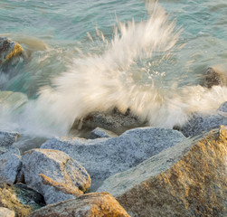 Sea waves crashing against rocks