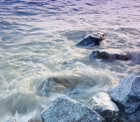 Sea waves crashing against rocks