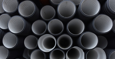 New black-and-white plastic pipes for sewerage system