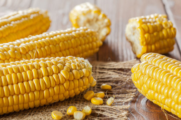 fresh corn on wooden table