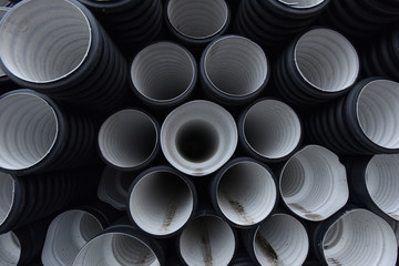 New black-and-white plastic pipes for sewerage system