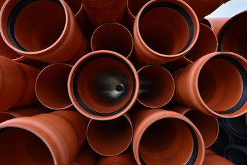 Large orange plastic pipes for sewerage system