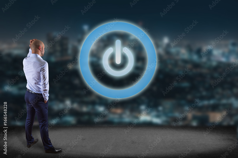 Poster businessman in front of a wall with power button symbol displayed on a futuristic interface - techno