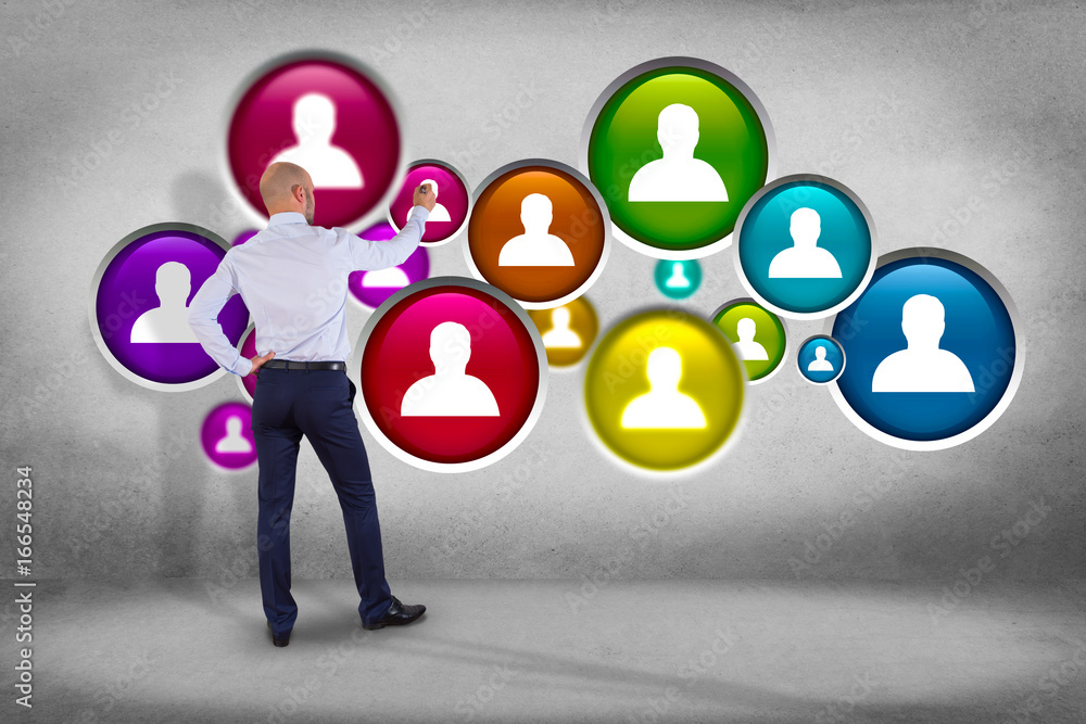 Poster businessman in front of a wall with a group of contact icon displayed on a technology interface back