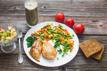 Breakfast on the wooden background from chicken breast