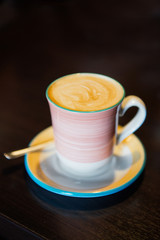 Tasty cappuccino in beautiful cup