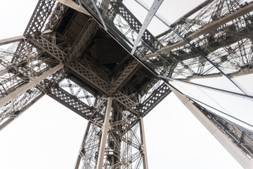 Paris, France - April 29, 2016: the Eiffel Tower from the bottom. Detail. Constructed from 1887–89 as the entrance to the 1889 World's Fair, it is a wrought iron lattice tower on the Champ de Mars