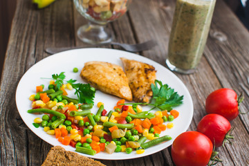 Breakfast on the wooden background from chicken breast