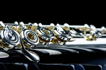 jazz music instrument flute close up isolated on black background