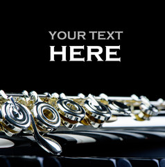 piano keyboard and flute instrument close up with place for  your text. © RomixImage