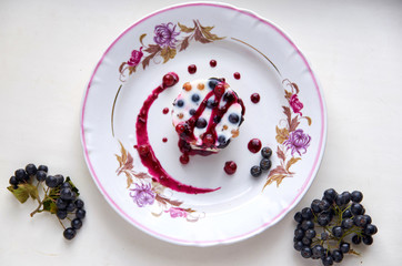 cool jelly dessert with fresh berries on a light plate. top view