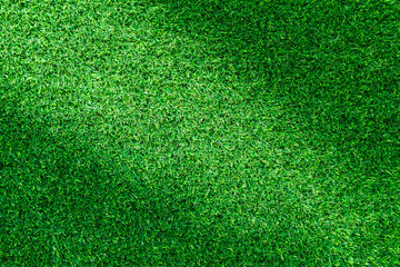 Obraz premium Artificial green grass texture for golf course. soccer field or sports background concept design.
