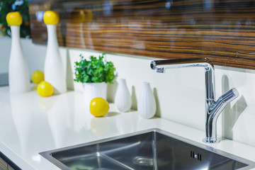 Kitchen interior, sink and cooking table. Selective focus.