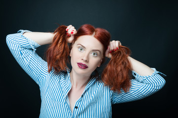 Fototapeta premium Sensual woman holding and pull her hair