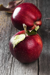 Fototapeta na wymiar Harvest of red apples on a dark wooden background