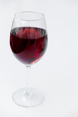 Red wine in a glass isolated on white background - realistic photo image